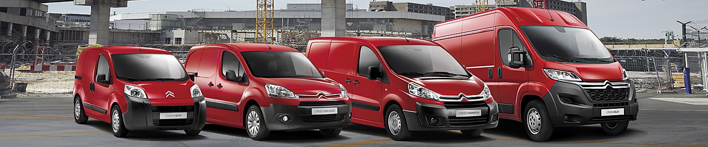 Fleet of red vans lined up side by side